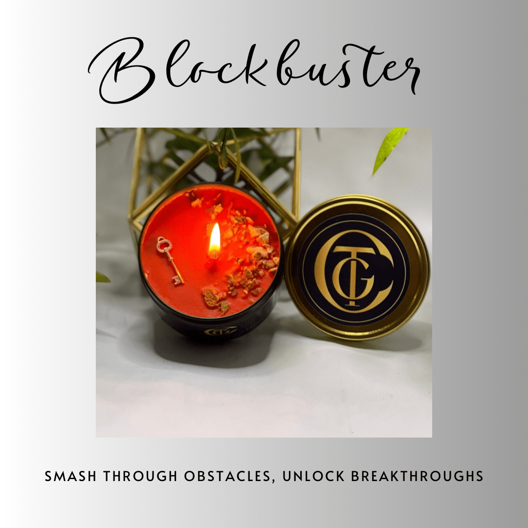 Candle with decorative elements and a gold lid on a light background, featuring the brand 'Blockbuster'.