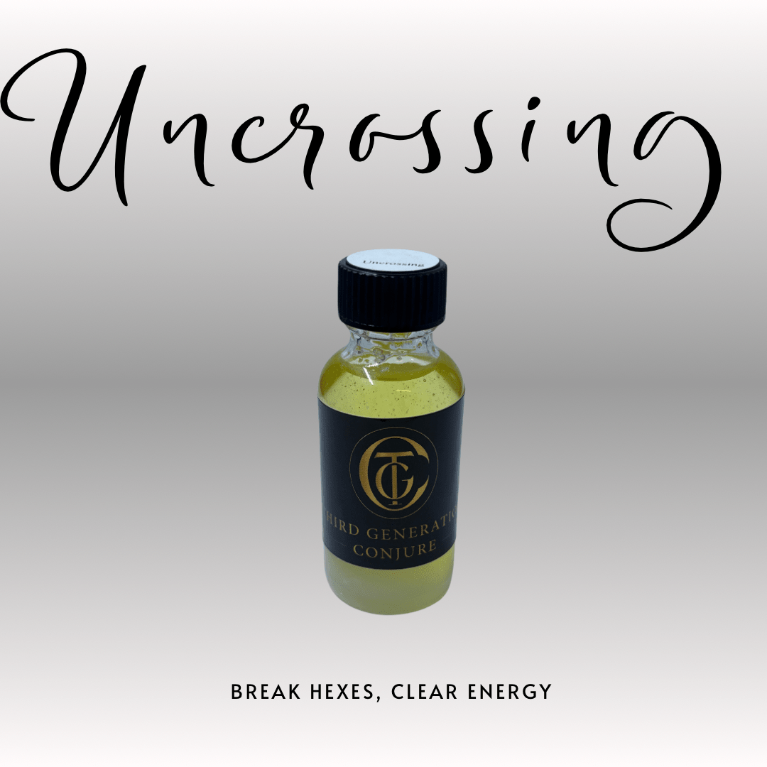 Bottle of 'Uncrossing' with a black cap and label on a light gray background.