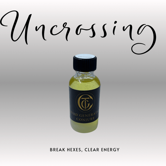 Bottle of 'Uncrossing' with a black cap and label on a light gray background.